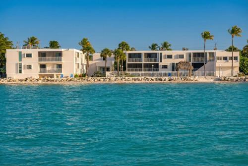 a view of a building from the water at Stylish Angler's Retreat, Poolside & Ocean Access #16 in Marathon