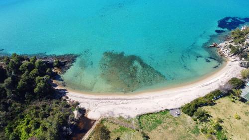 an aerial view of a beach and the ocean at Hacienda Beachfront Villa, Spathies in Nikiti