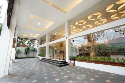 a store front of a building with large windows at 1O1 URBAN Heritage Yogyakarta Lynn Prawirotaman in Yogyakarta
