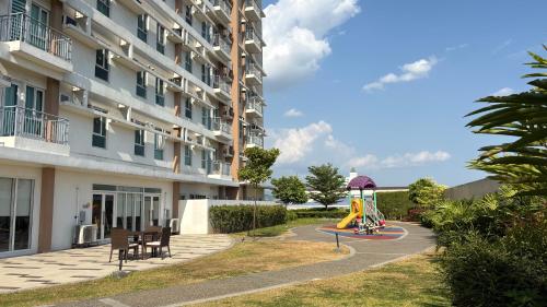 a playground in front of a building at Peppers Crib in Manila