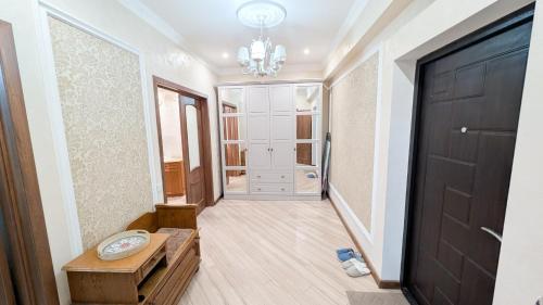a hallway of a home with a black door at Airport Transit Studio Ночь перед вылетом in Chişinău