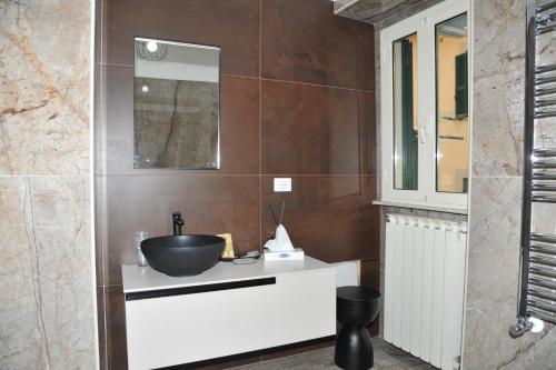 a bathroom with a sink and a mirror at Il Valentino in Castel Gandolfo