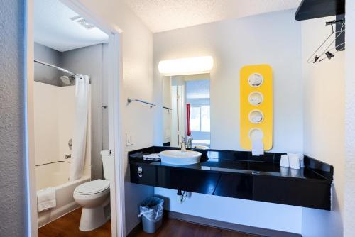 a bathroom with a sink and a toilet at Motel 6-Pleasanton, CA in Pleasanton