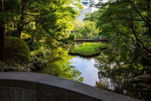 a bridge over a river in a park at -Ebisu 2come- 10-minute walk from Ebisu Station in Tokyo