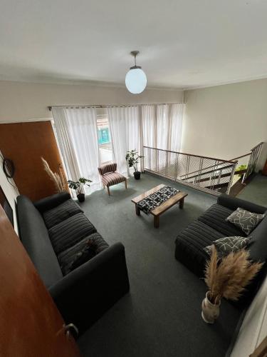 a living room with a couch and a coffee table at Nuevo Hotel Córdoba in Villa Carlos Paz