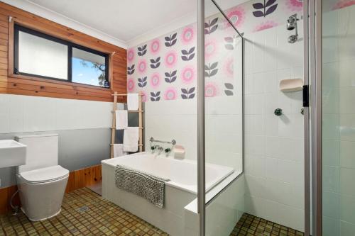 a bathroom with a toilet and a sink and a shower at Lady Marmalade in Blackheath
