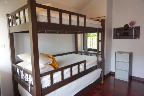 a couple of bunk beds in a room at Southern Lanta A4 in Ko Lanta