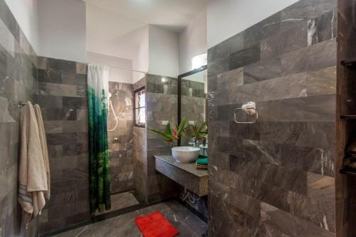 a bathroom with a shower and a sink at Southern Lanta A4 in Ko Lanta