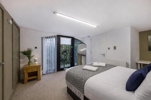 a bedroom with a large bed and a window at Ward St Residence - Parking - Lpool City Centre in Liverpool
