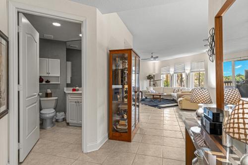 a room with a kitchen and a living room at Coastal Serenity Spacious 3Br Condo In Minorca in New Smyrna Beach