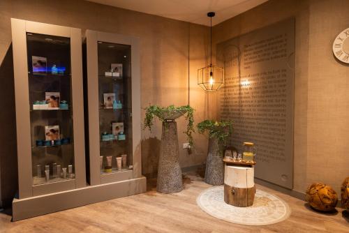 a display case with two vases in a room at MARGADINA HOTEL in Ayia Napa