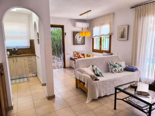 a living room with a couch and a table at Casa Marti in Roda de Bará