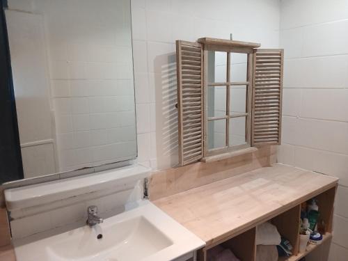 a bathroom with a sink and a mirror at Massilia in Marseille