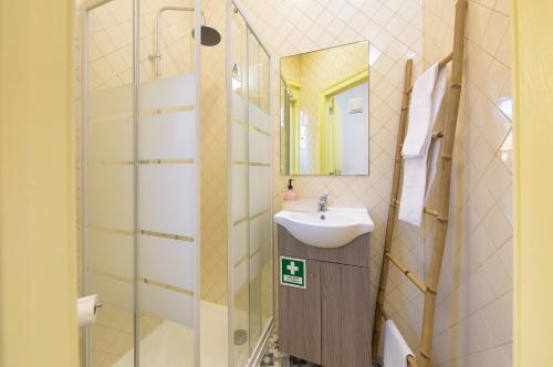 a bathroom with a sink and a mirror at Casa Mariana 1 - Sintra, Pena Palace & Castle Views, Terrace Apartment in Sintra