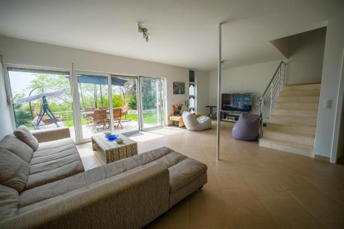 a living room with a couch and a slide at Vila Brca in Brca