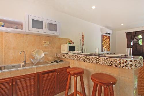 A kitchen or kitchenette at Soleil D'asie Residence