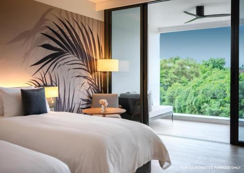 a bedroom with a white bed and a large window at Stay Wellbeing & Lifestyle Resort in Rawai Beach