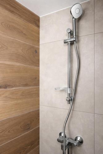 a shower with a shower head in a bathroom at Top Location Studios - Avra, Boreio and Kyma in Larnaca