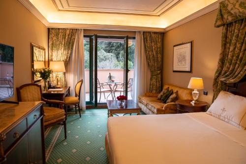 a hotel room with a bed and a living room at River Chateau Hotel in Rome