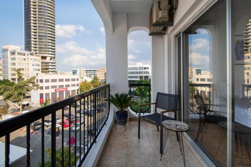 a balcony with a view of a city at Urban Condo Promitheos in Nicosia