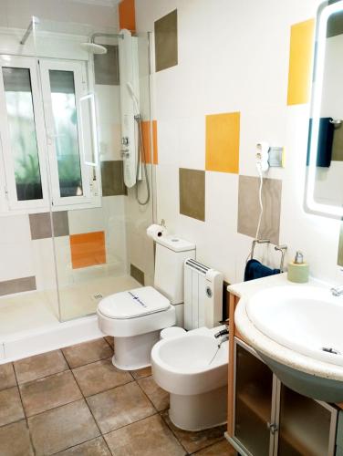 a bathroom with a toilet and a sink at Apartamento limonero ,VUT AL 13044 in Albox