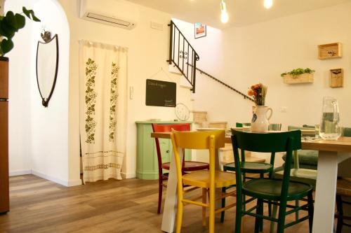 a dining room with a table and chairs at Locanda dei Gelsomini in Civitella Del Lago