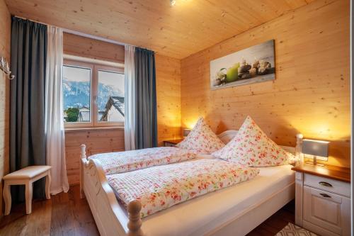 a bedroom with a bed in a room with a window at Ferien Bei Mari in Schwangau