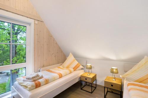 a living room with a couch and a window at Ferienhaus Wasserfall in Bestwig