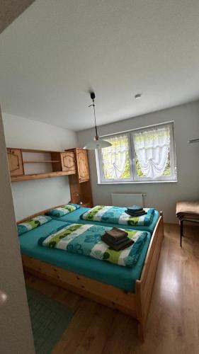 a bedroom with a large bed in a room at Villa Fichteneck in Oberhof