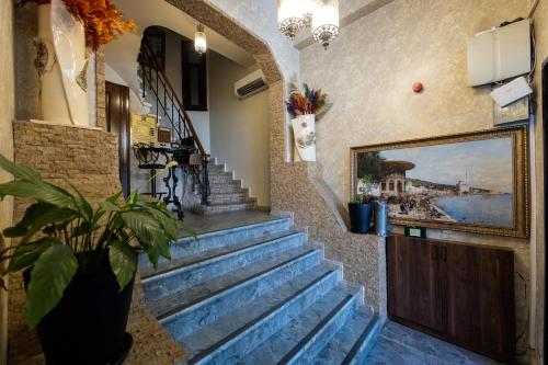 a staircase in a building with a potted plant at Nan Hotel in Istanbul