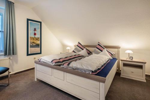 a bedroom with a bed with a lighthouse on it at Ferienwohnung 2 Soltau in Soltau