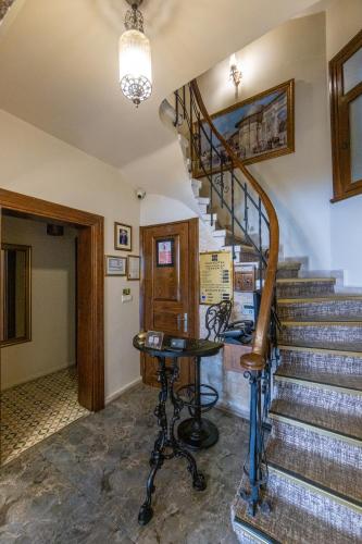 a staircase in a house with a desk in a room at Nan Hotel in Istanbul
