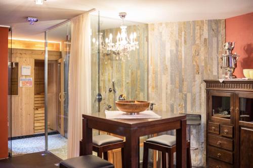 a bathroom with a sink and a shower at Residence Grünbacher in Issengo