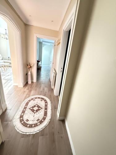an empty hallway with a rug on a hard wood floor at Panoramic View apartment Seraidi Annaba in Annaba