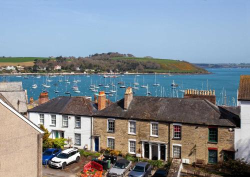 a group of houses and a harbor with boats at 21 Gyllyng Street in Falmouth