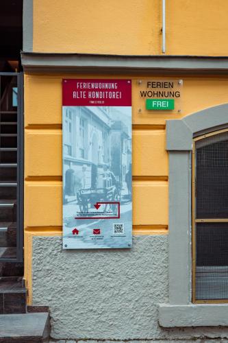 a sign on the side of a building at Alte Konditorei in Lindau