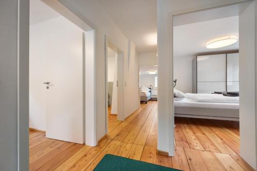 a bedroom with a bed and a green rug at Ferienhaus Bergmann mit Sauna in Wildemann