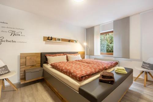 a bedroom with a large bed in a room at Ferienwohnung Klein und Fein in Edertal
