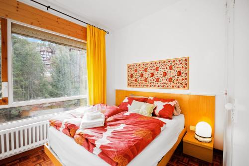 a bed in a room with a window at Masella in La Masella