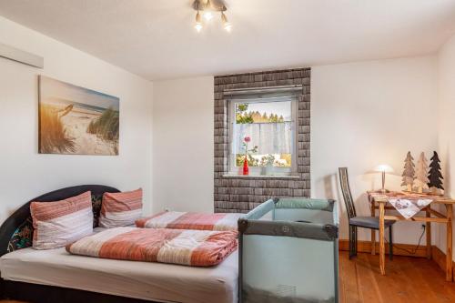 a bedroom with a bed and a window at Möblierte Wohnung Ferienwohnung in Aicha vorm Wald