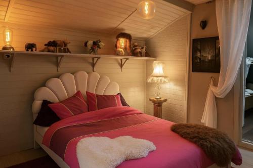 a bedroom with a large bed in a room at Chalet Le Puy Papillon in Servières-le-Château