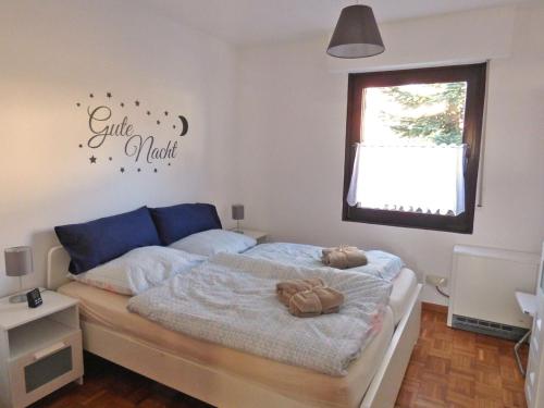 a bedroom with a bed and a window at Ferienhaus Höhenflug in Attendorn