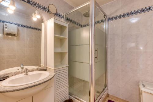 a bathroom with a sink and a shower at Madrague St Vincent Apt B in Le Grau-dʼAgde