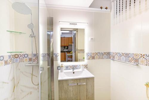 a bathroom with a sink and a shower at Alohe Puertorico View in Puerto Rico de Gran Canaria