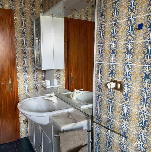 a bathroom with a sink and a mirror at Casa Nova in Porte di Rendena