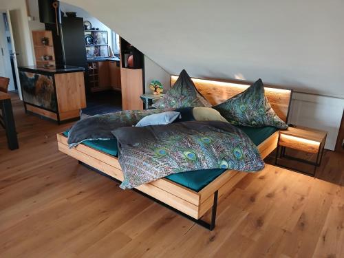 a bed with pillows on it in a room at Hof Sorgenfrei in Buch