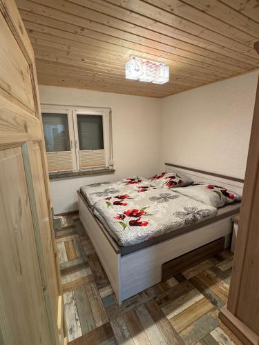 a bedroom with a bed in a small room at Ferienhaus Haffstille in Ueckermünde