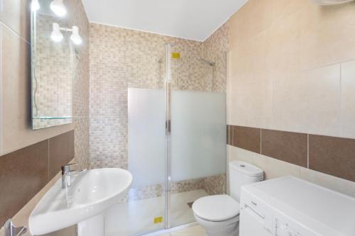 a bathroom with a sink and a toilet and a shower at Mareverde K130 in Adeje