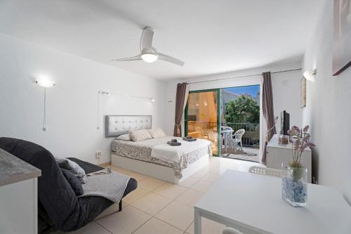 a living room with a bed and a couch at Mareverde K130 in Adeje