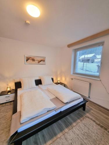 a large bed in a room with a window at Apartment Gina in Stall